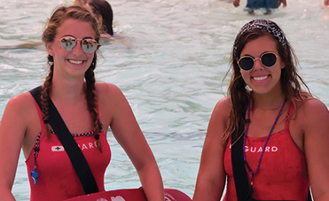 Two lifeguards in water 